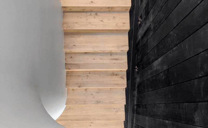 M2 Carpentry Timber stairs and black cladding internal fit out